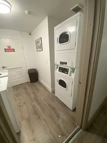 a view of a storage and utility room with washer and dryer