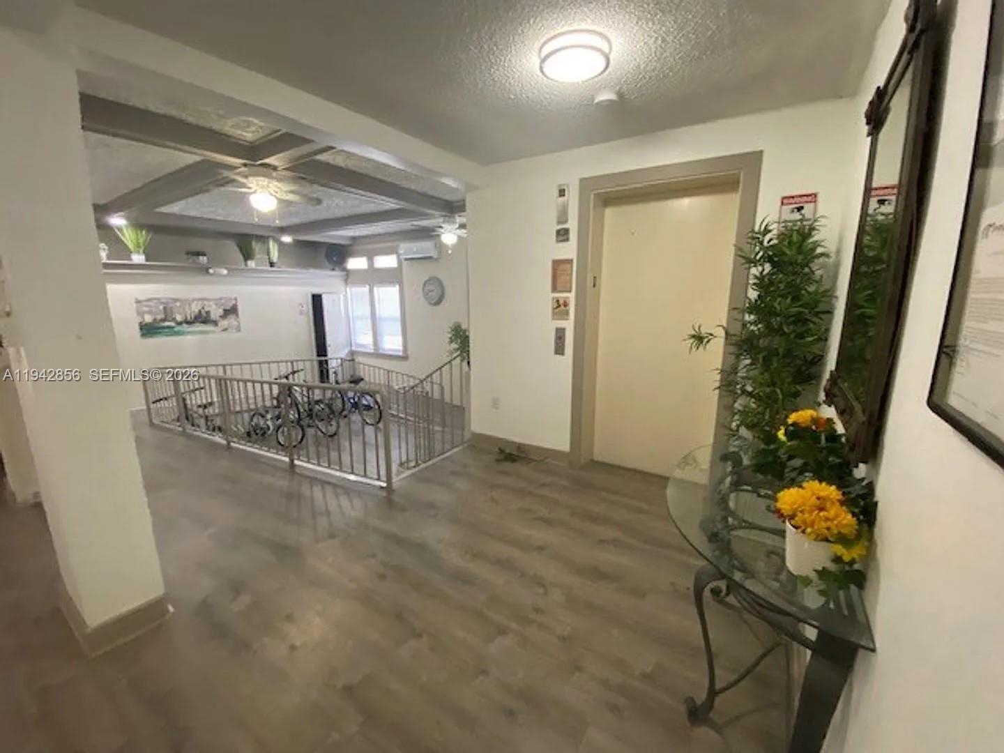 501 Southwest 6th Court, Unit 327 Miami, FL 33130 - Photo 14 of 20 a view of a room with furniture and a chandelier