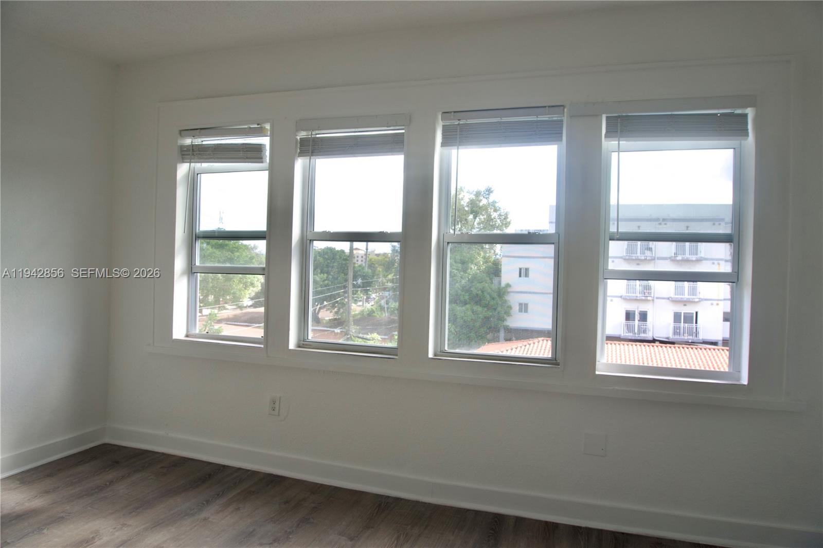 501 Southwest 6th Court, Unit 327 Miami, FL 33130 - Photo 4 of 20 an empty room with a window