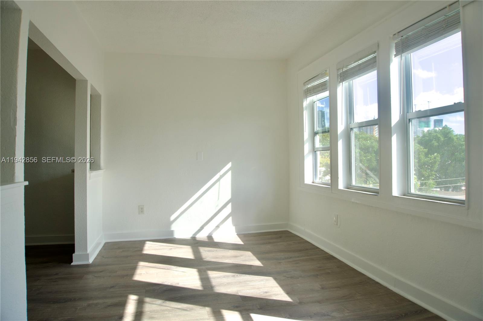 501 Southwest 6th Court, Unit 327 Miami, FL 33130 - Photo 5 of 20 a view of an empty room and wooden floor