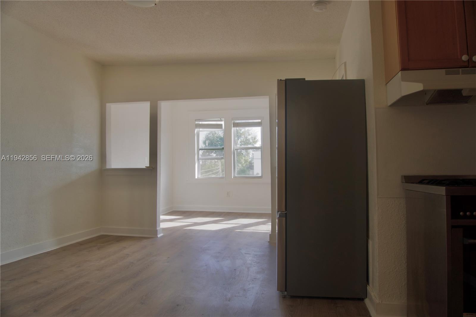 501 Southwest 6th Court, Unit 327 Miami, FL 33130 - Photo 6 of 20 a view of an empty room with closet and a window