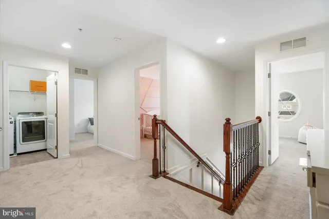 a view of a hallway with staircase