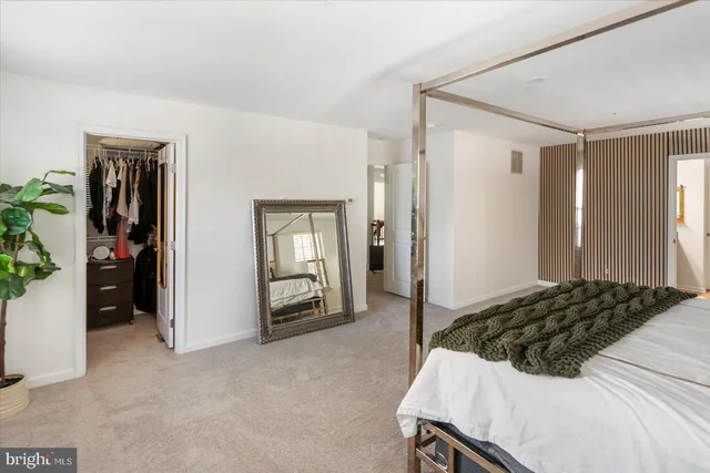 a bedroom with a bed and a sink