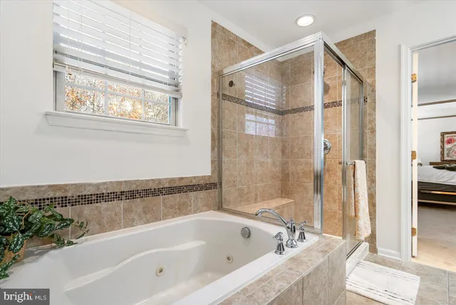 a bathroom with a bathtub and a shower