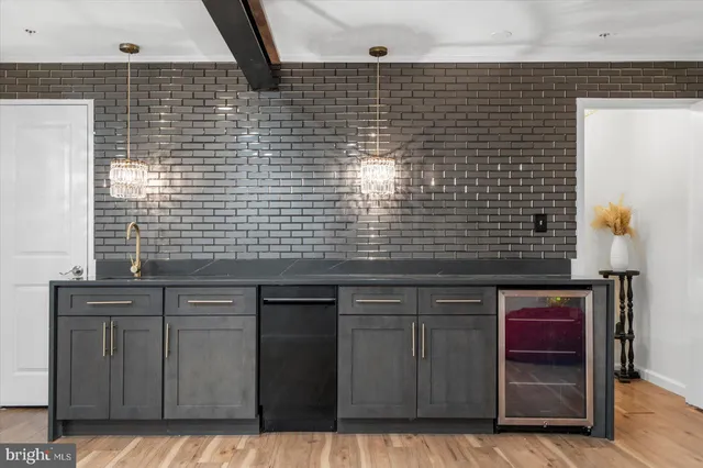 a kitchen with a sink cabinets and window