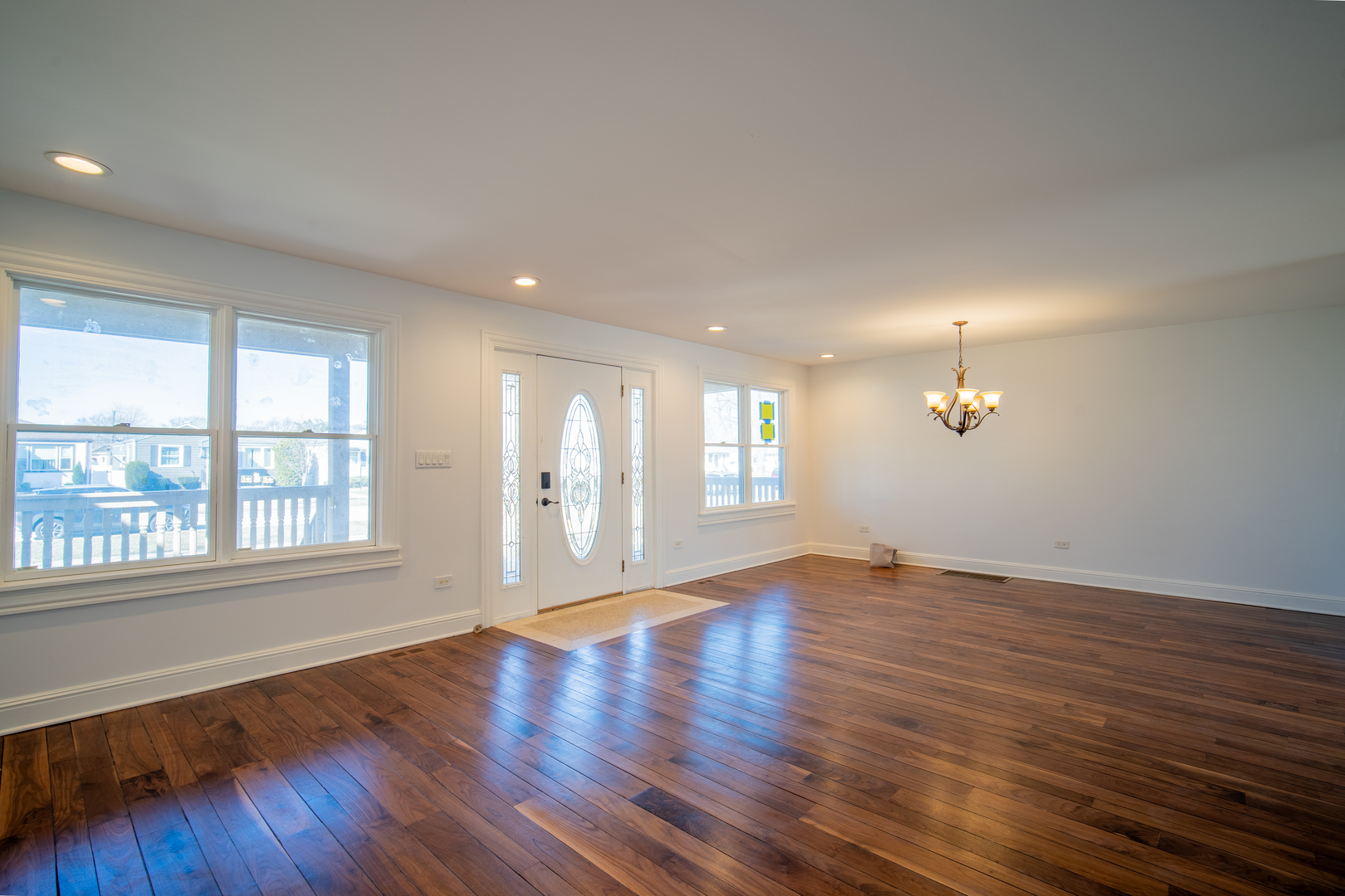 4137 Clinton Avenue Stickney, IL 60402 - Photo 13 of 41 an empty room with wooden floor and windows