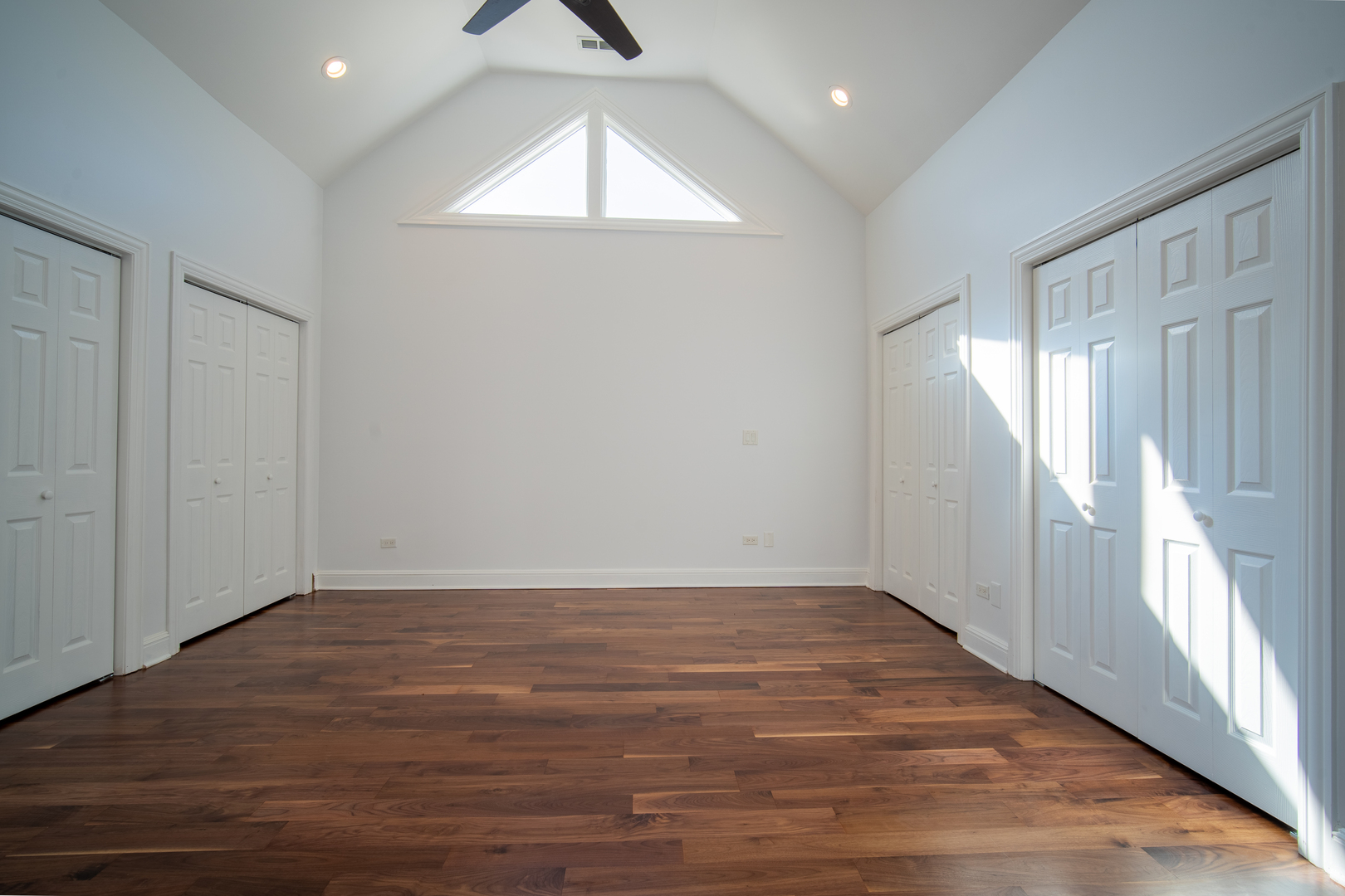 4137 Clinton Avenue Stickney, IL 60402 - Photo 21 of 41 an empty room with wooden floor and windows
