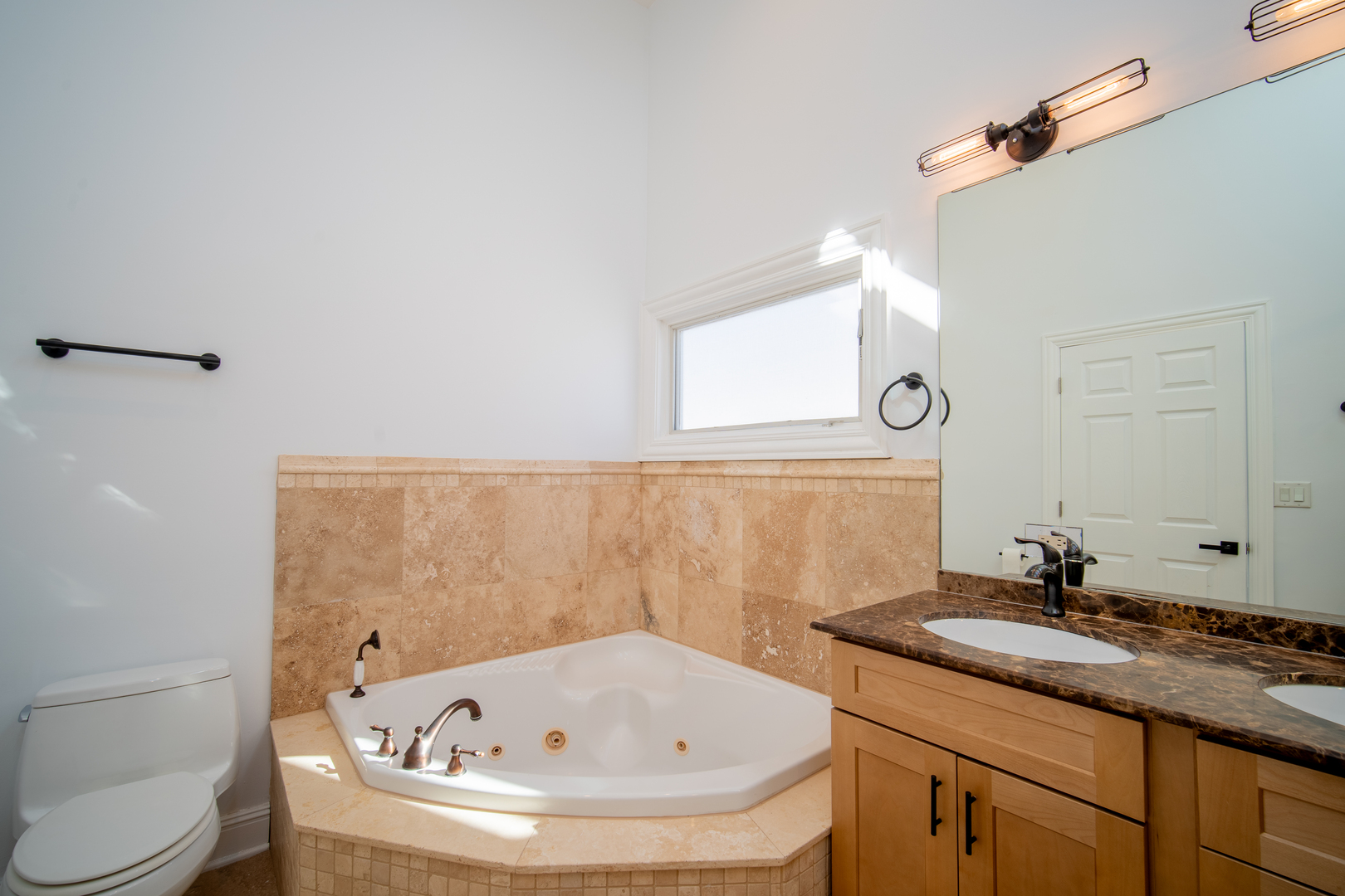 4137 Clinton Avenue Stickney, IL 60402 - Photo 27 of 41 a bathroom with a granite countertop sink a toilet and mirror