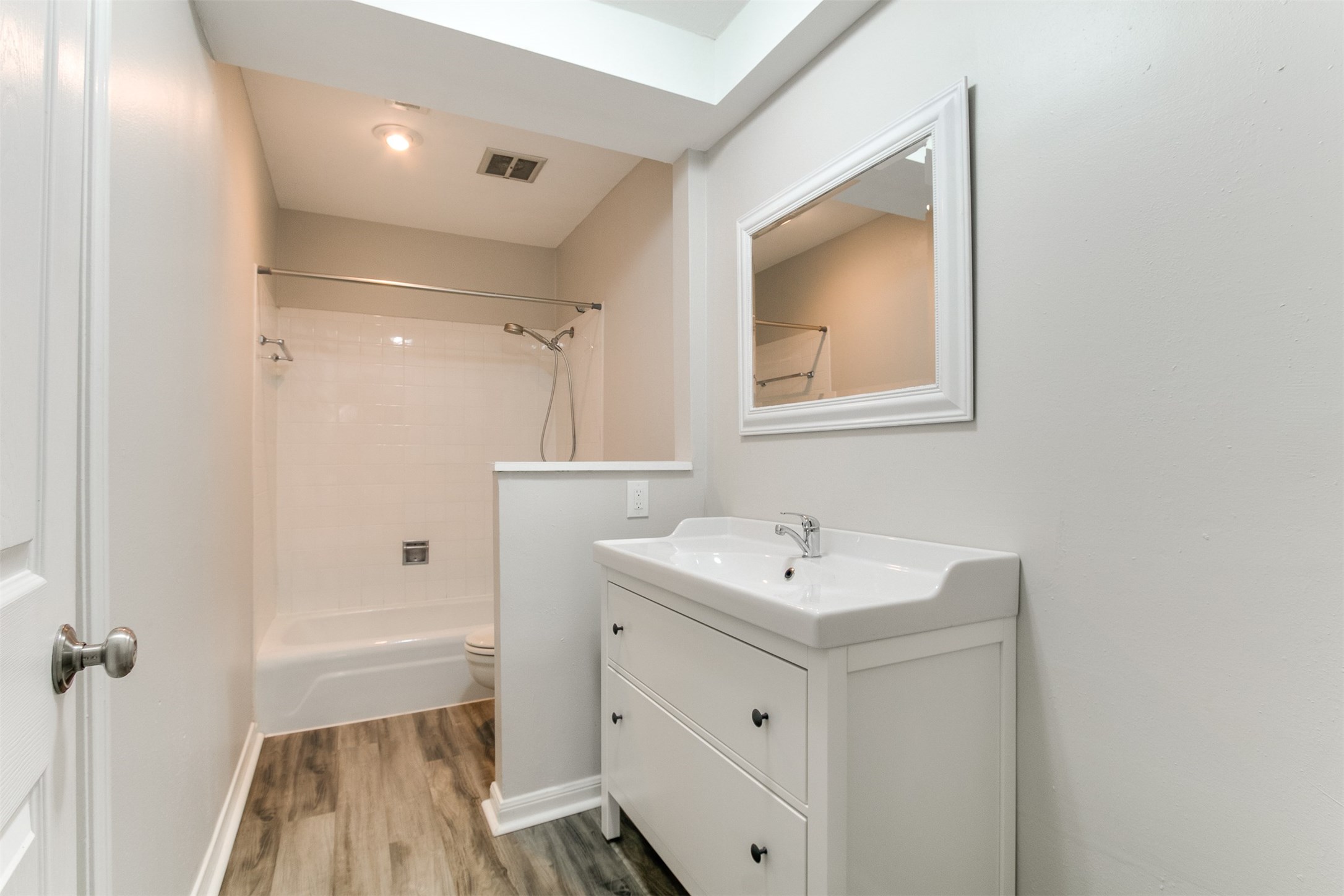 1407 Springrock Lane Houston, TX 77055 - Photo 12 of 25 Beautiful flooring underscores the freshly decorated Master Bath with updated vanity, tray ceiling and shower/tub combination.