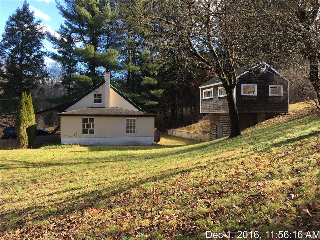 20 White Deer Rocks Road Woodbury, CT 06798 - Photo 1 of 1 a front view of a house with a yard covered with snow
