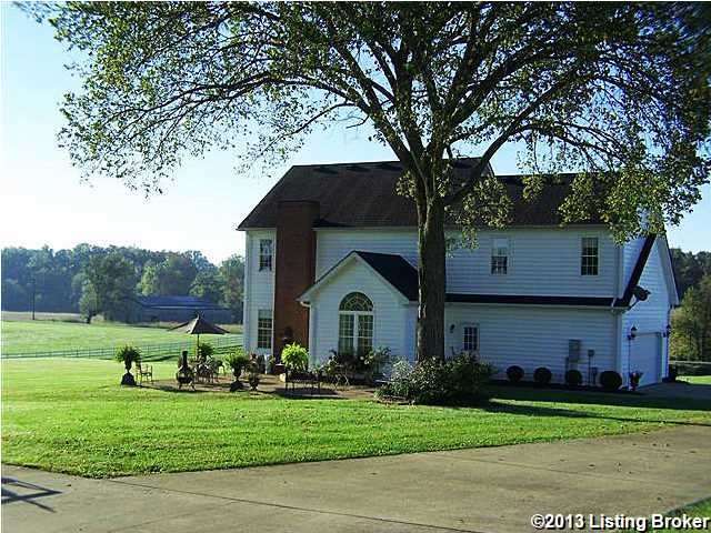 STUNNING 5.17 ACRES!! This 4 large Bedroom, 2.5 Bath home is setting on an incredible 5 acres with attached 2.5 Car Garage, detached 3 Car Garage/Workshop/Barn, Great Room, Formal Dining Room, Office/Study/5th Bedroom with carpet, Gazebo, large two-tier concrete patio, creek running through acreage, gleaming hardwood and ceramic tile flooring throughout!!