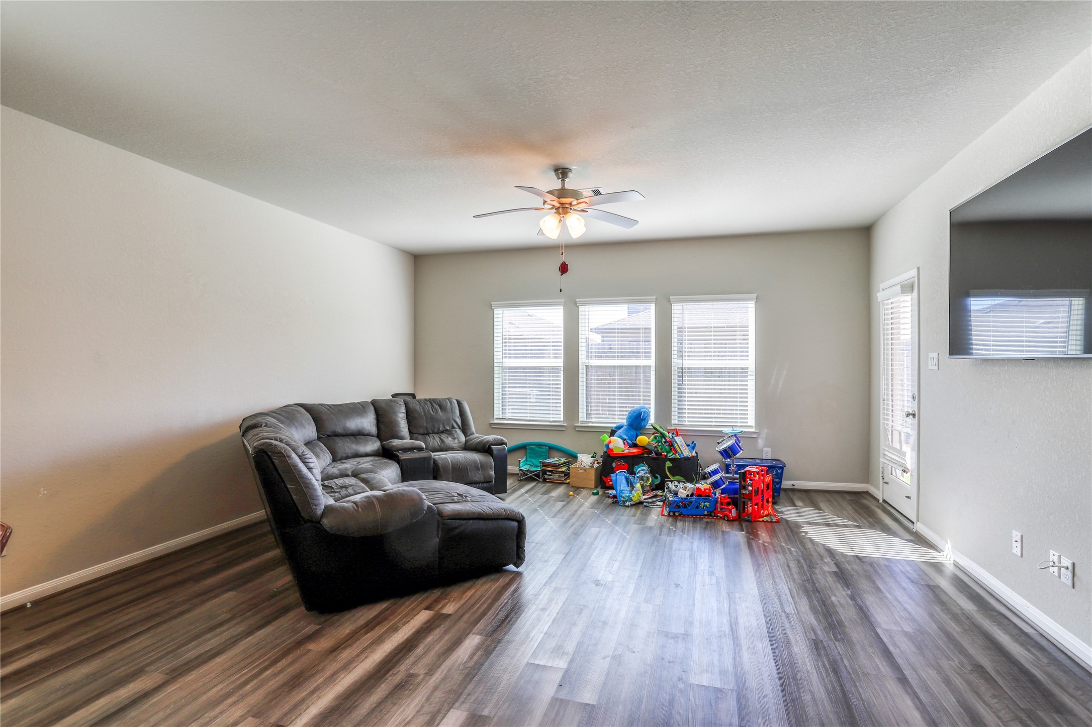 830 Modesto Drive Rosharon, TX 77583 - Photo 10 of 11 a living room with furniture and a large window