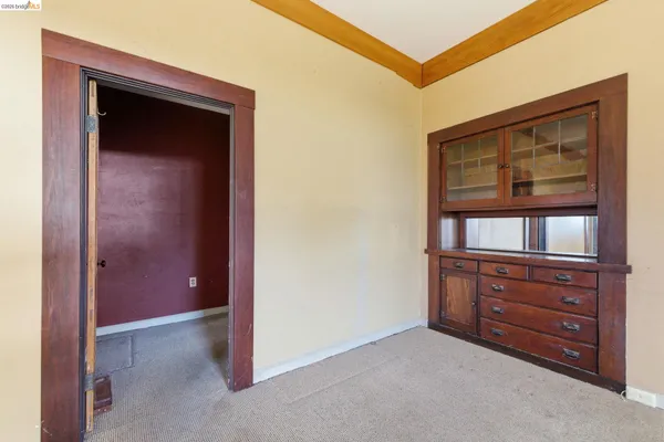 a view of room with closet and cabinet