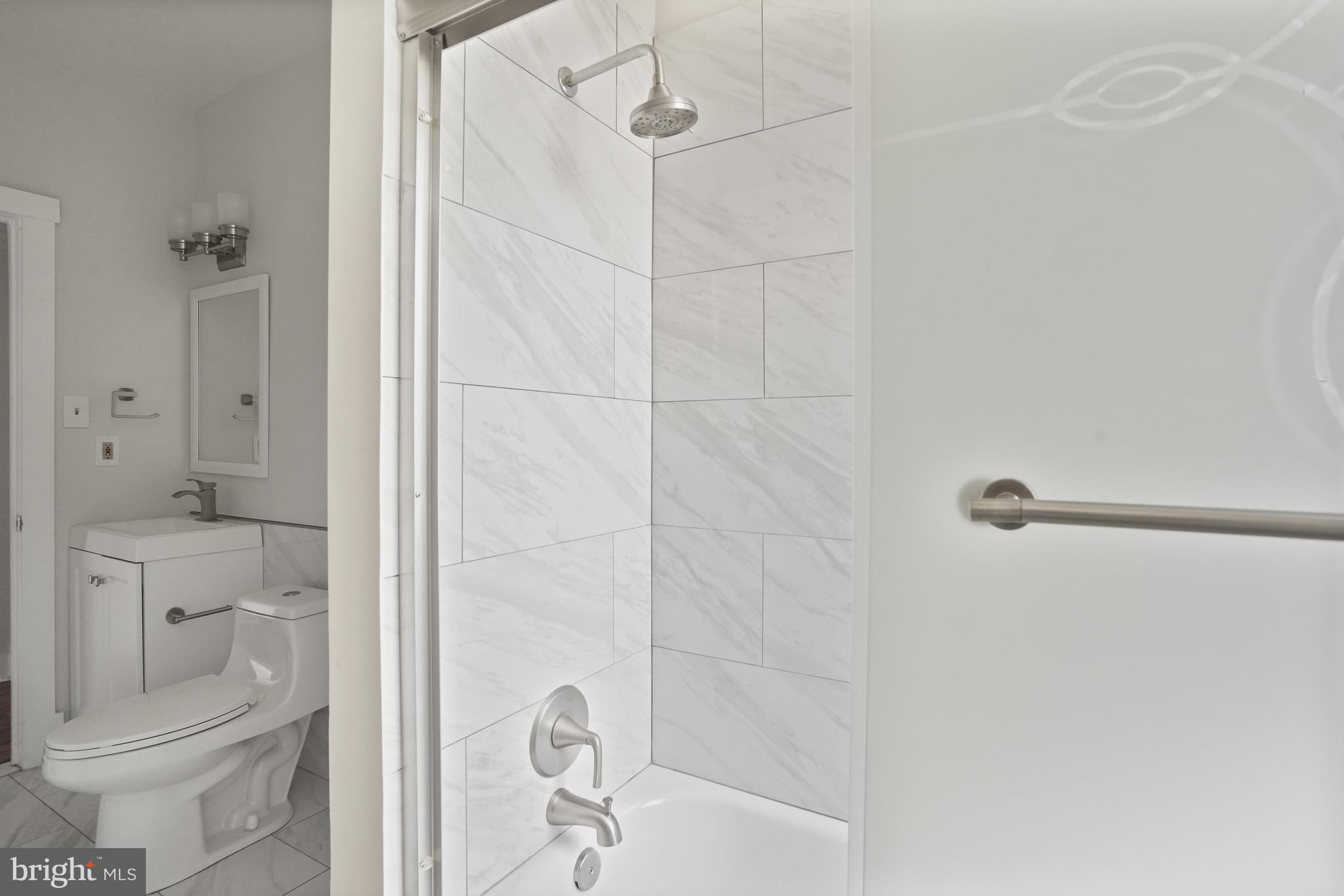 7 18th Street Southeast, Unit 208 Washington, DC 20003 - Photo 11 of 21 a bathroom with a shower and toilet