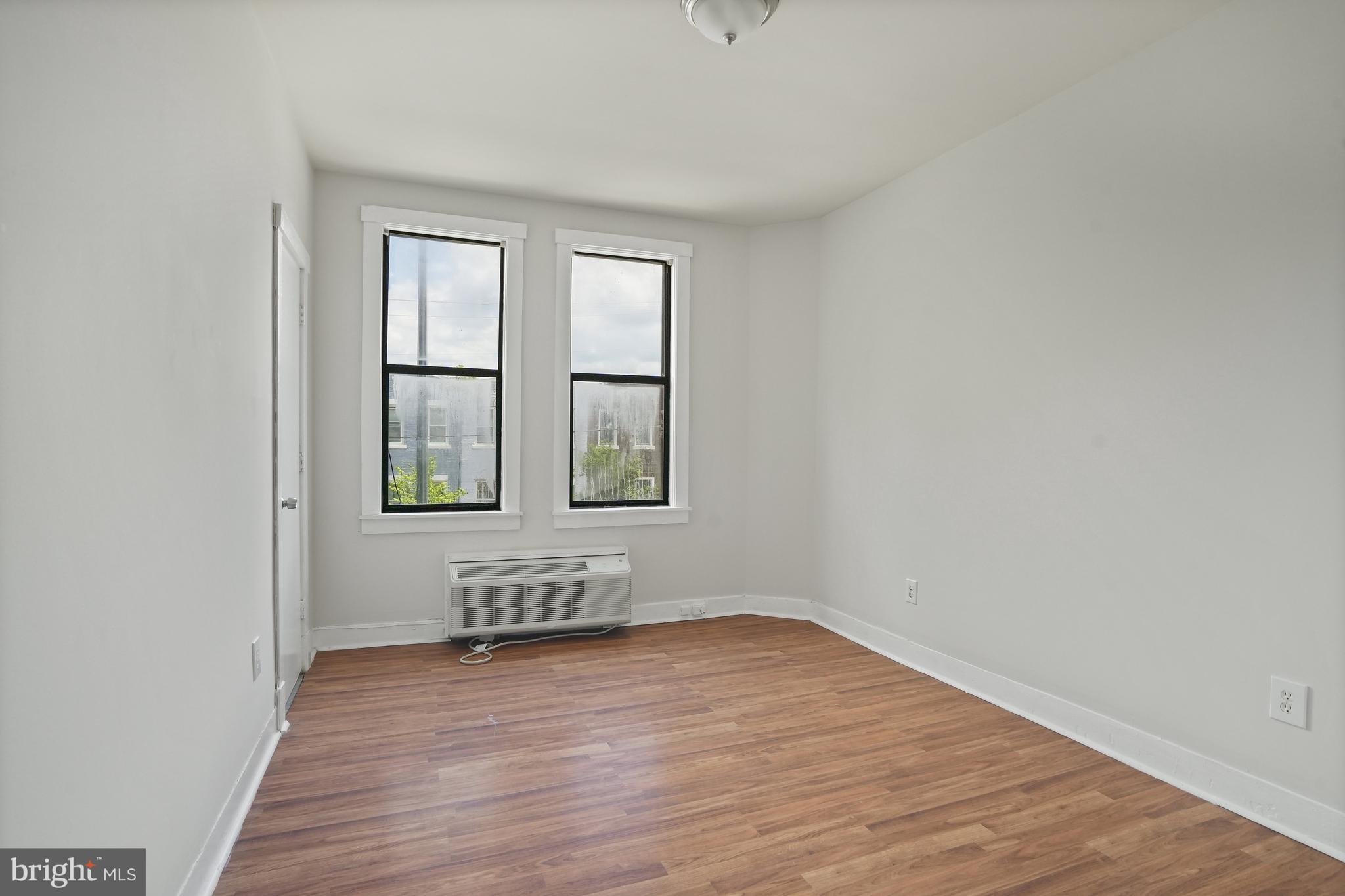 7 18th Street Southeast, Unit 208 Washington, DC 20003 - Photo 14 of 21 a view of wooden floor and windows in a room