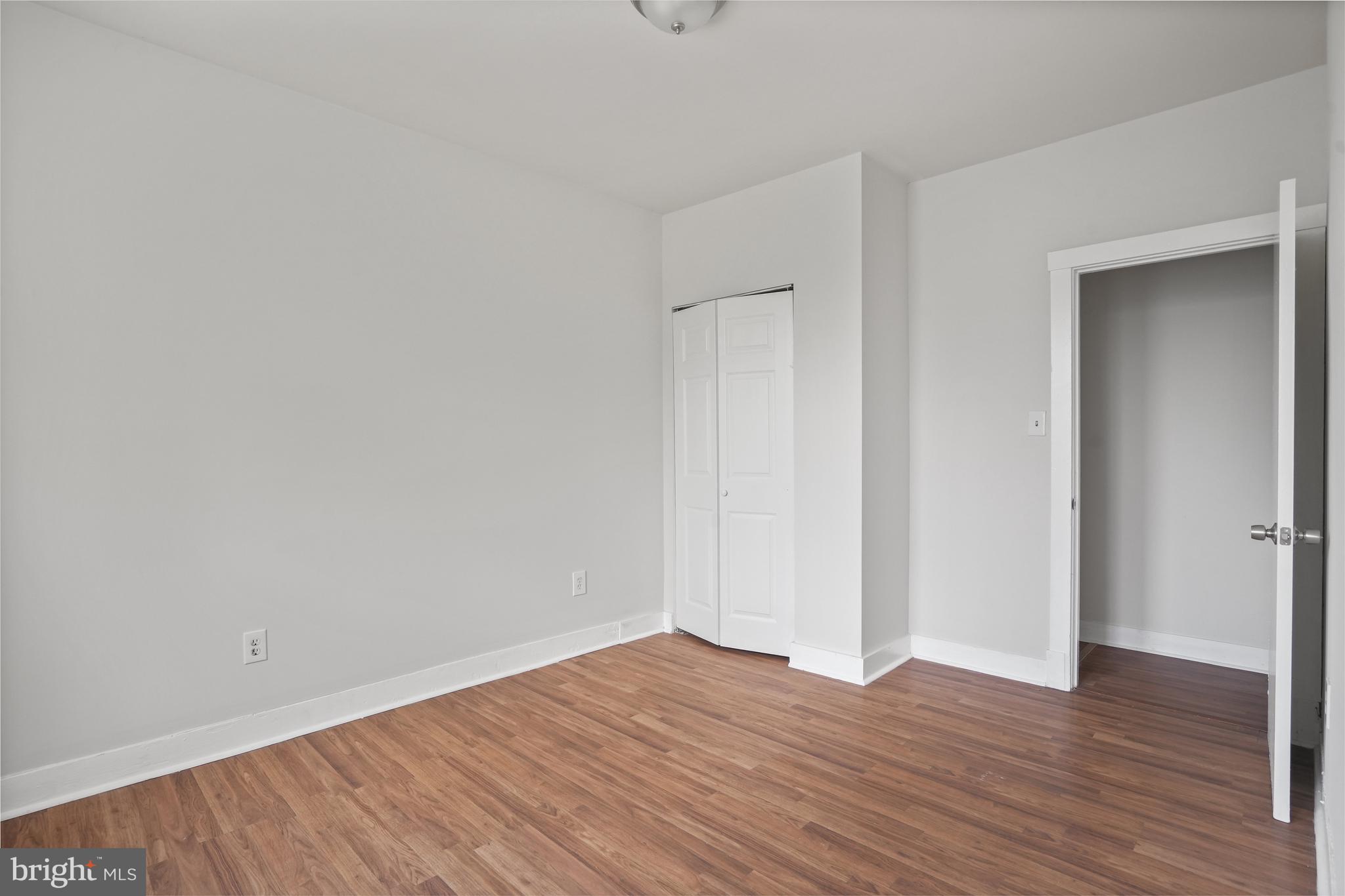 7 18th Street Southeast, Unit 208 Washington, DC 20003 - Photo 15 of 21 a view of an empty room with wooden floor and closet