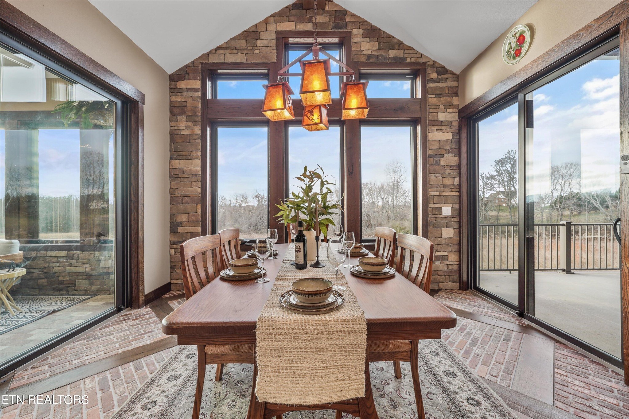 1150 Hillendale Road Crossville, TN 38572 - Photo 12 of 42 a view of a dining room with furniture large windows and wooden floor