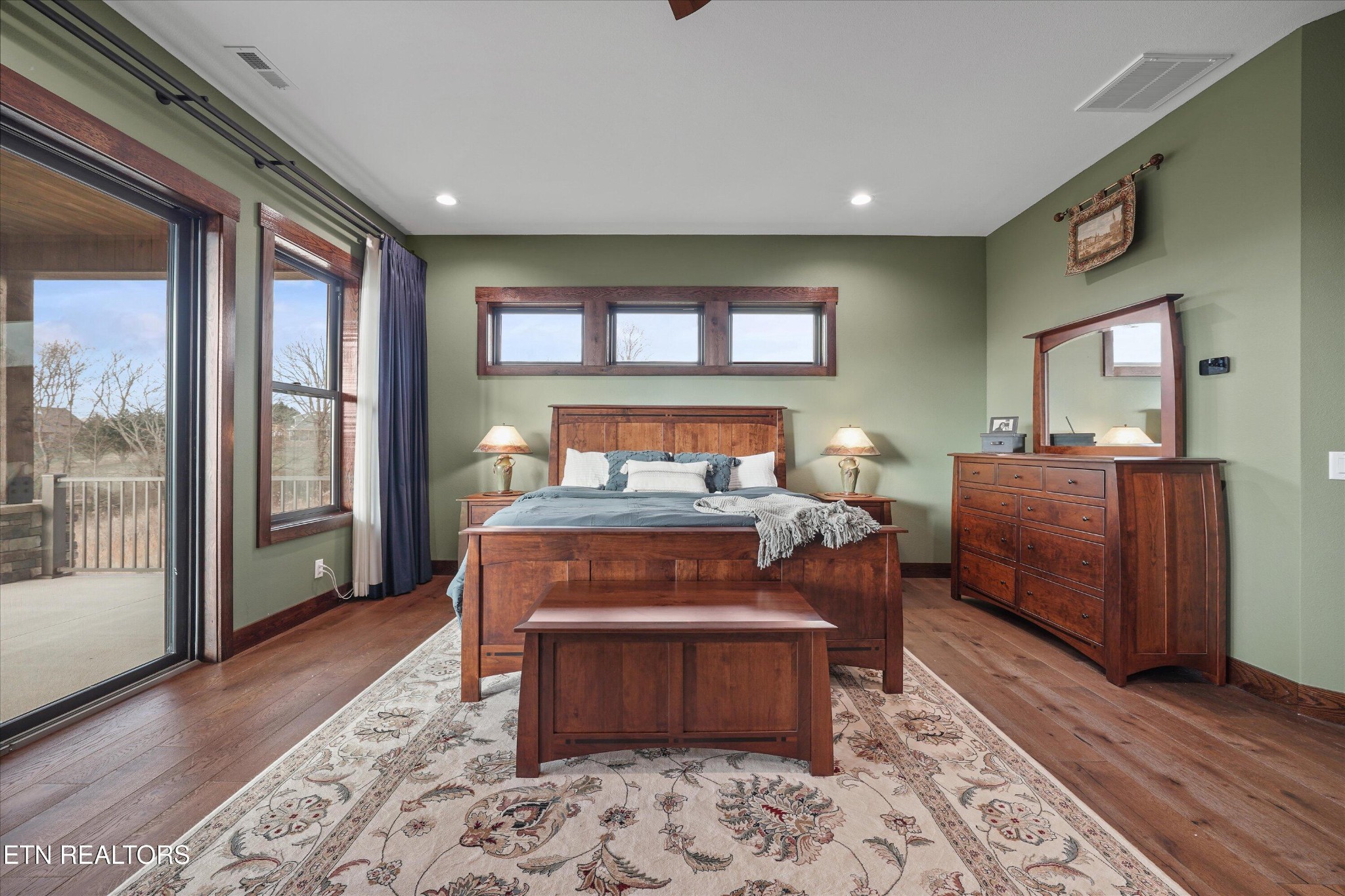 1150 Hillendale Road Crossville, TN 38572 - Photo 28 of 42 a bedroom with a large bed and wooden floor