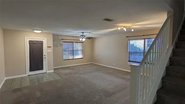 a view of an empty room with a fireplace