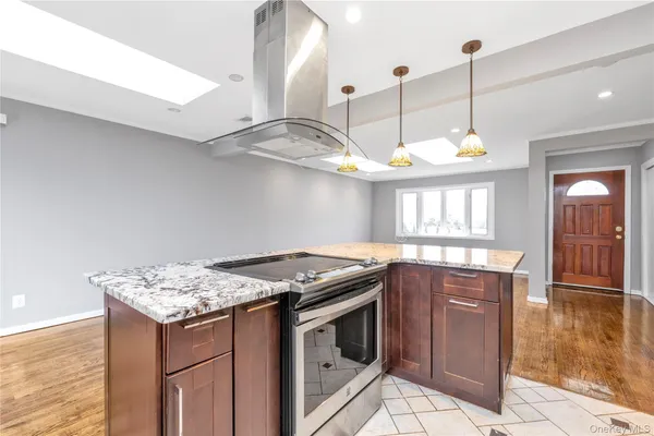 a kitchen with a stove and a sink
