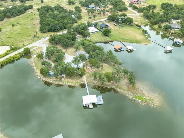 a swimming pool with some trees in the background