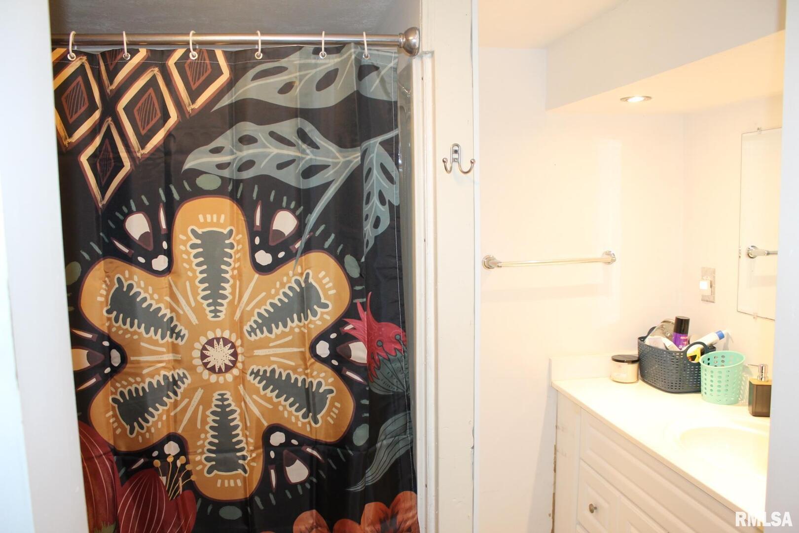 321 West South Street Cambridge, IL 61238 - Photo 11 of 26 a bathroom with a sink and a mirror