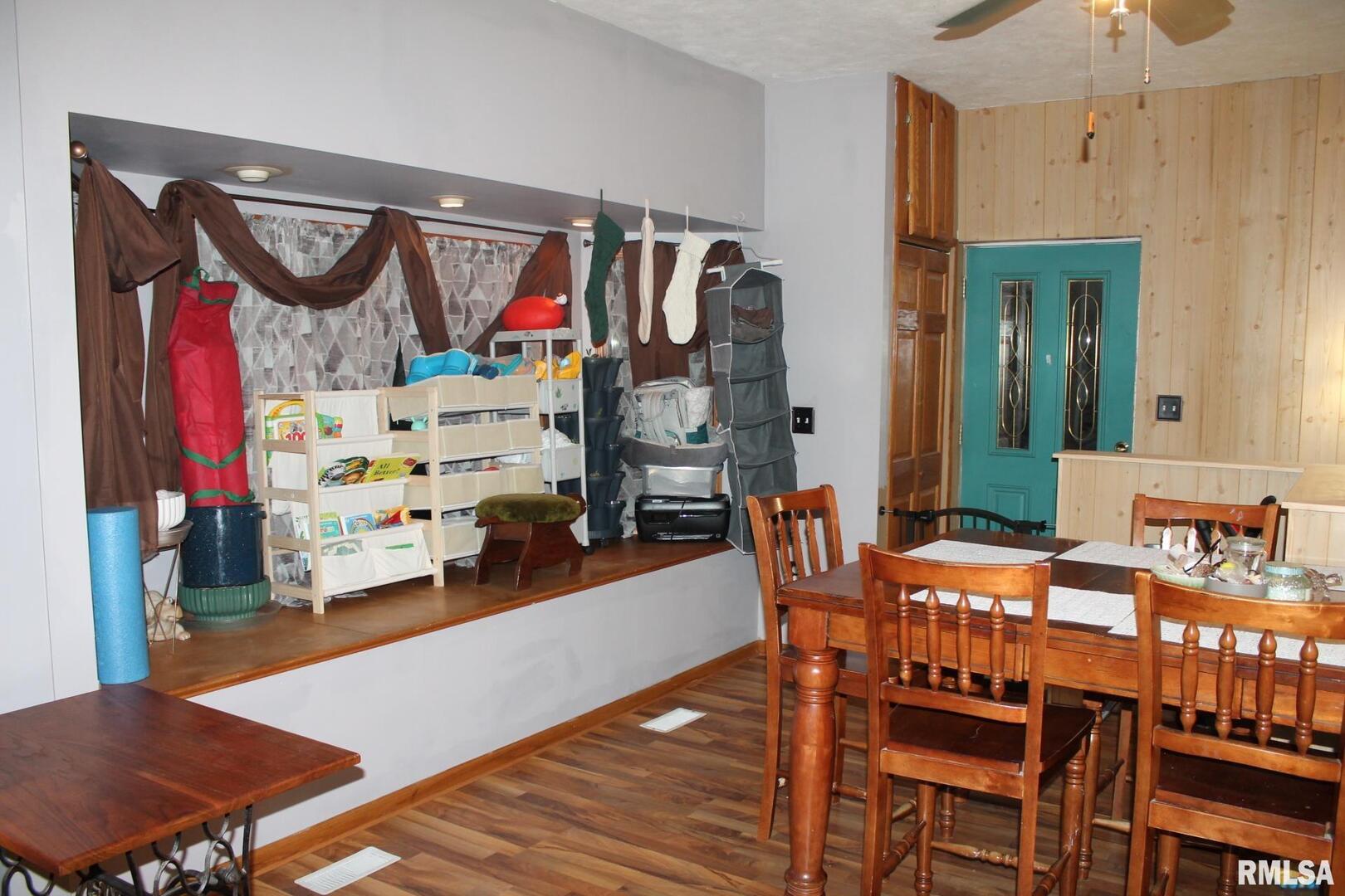 321 West South Street Cambridge, IL 61238 - Photo 14 of 26 a view of a dining room with furniture and wooden floor