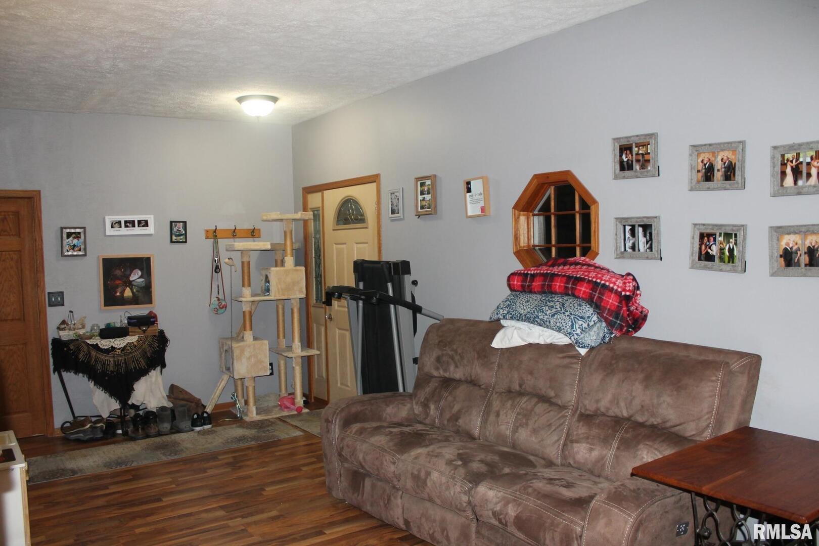 321 West South Street Cambridge, IL 61238 - Photo 17 of 26 a living room with furniture and a flat screen tv