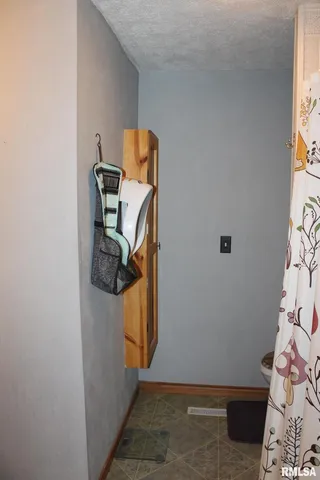 a bathroom with a sink vanity and a mirror