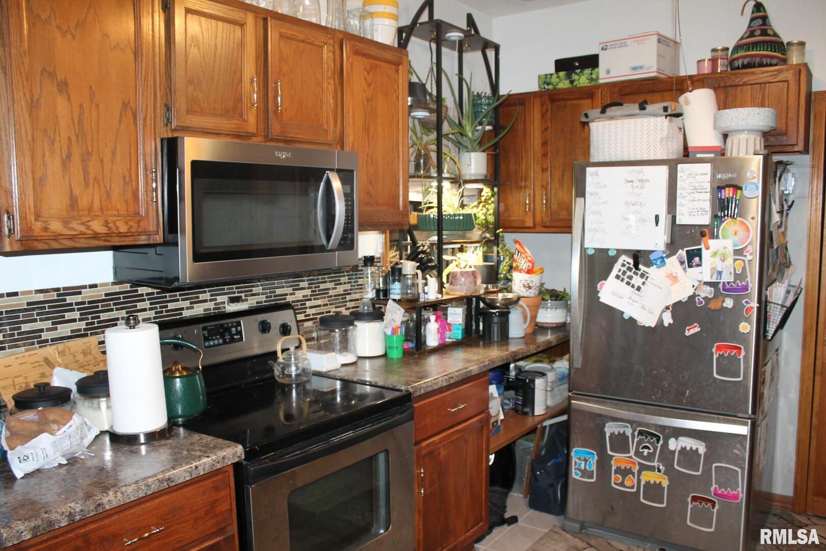 321 West South Street Cambridge, IL 61238 - Photo 26 of 26 a kitchen with stainless steel appliances granite countertop a stove and a microwave