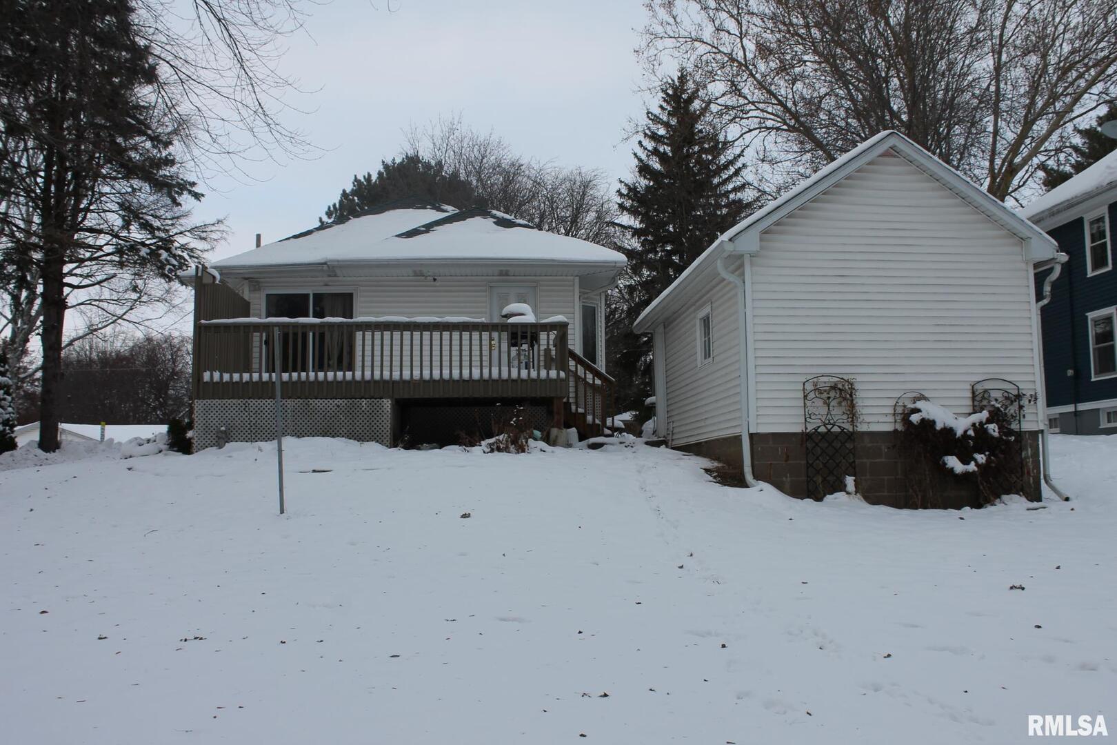 321 West South Street Cambridge, IL 61238 - Photo 6 of 26 a view of a house with a snow in the yard