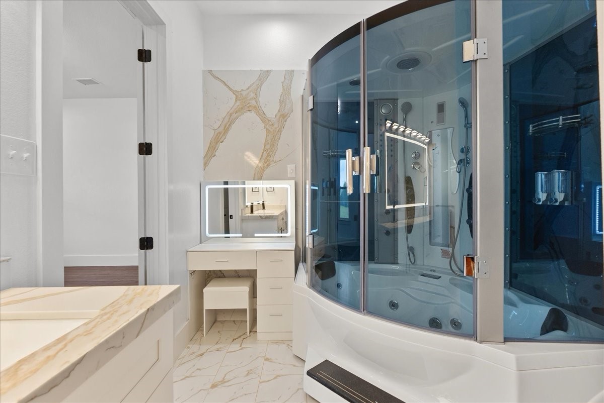 3237 Harkey Road Pearland, TX 77584 - Photo 8 of 46 Luxury spa shower with steam features, jets, and built-in seating in Primary bath