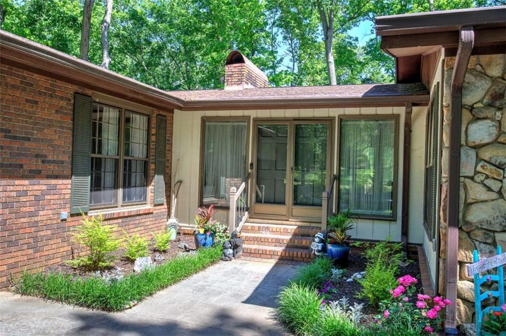 567 Fred Kelly Road Northeast Rome, GA 30161 - Photo 11 of 59 a front view of a house with garden