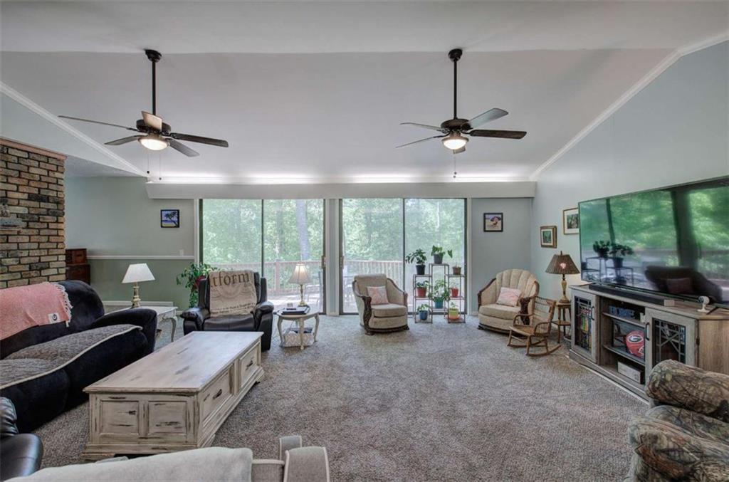 567 Fred Kelly Road Northeast Rome, GA 30161 - Photo 14 of 59 a living room with furniture ceiling fan and a large window