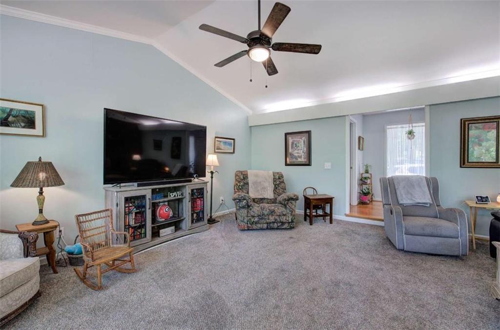 567 Fred Kelly Road Northeast Rome, GA 30161 - Photo 16 of 59 a living room with furniture and a flat screen tv