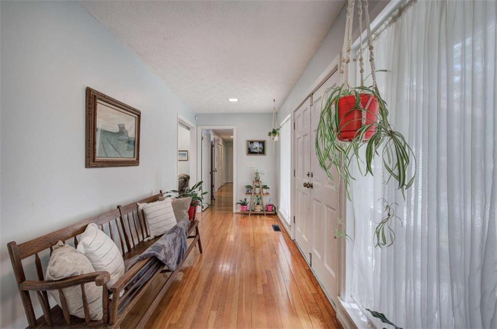 567 Fred Kelly Road Northeast Rome, GA 30161 - Photo 20 of 59 a living room with furniture and a wooden floor