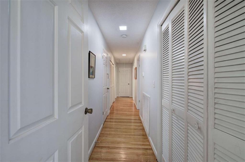 567 Fred Kelly Road Northeast Rome, GA 30161 - Photo 22 of 59 a view of a hallway with wooden floor and staircase