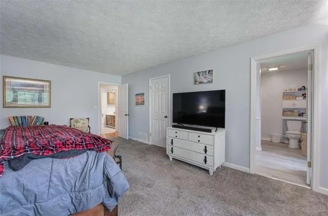a view of walk in closet with clothes