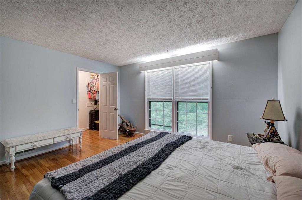 567 Fred Kelly Road Northeast Rome, GA 30161 - Photo 31 of 59 a bed room with a bed and a window