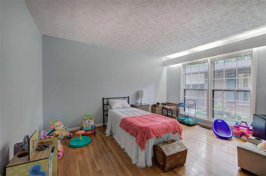 567 Fred Kelly Road Northeast Rome, GA 30161 - Photo 33 of 59 a bedroom with furniture and a bed