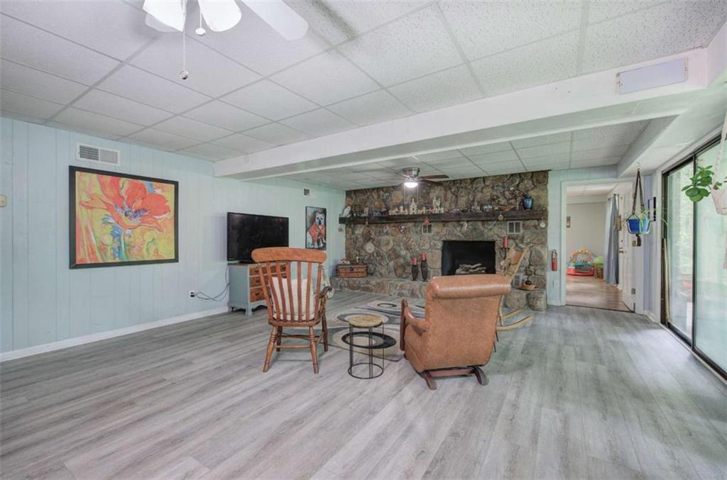 567 Fred Kelly Road Northeast Rome, GA 30161 - Photo 45 of 59 a living room with furniture and a wooden floor
