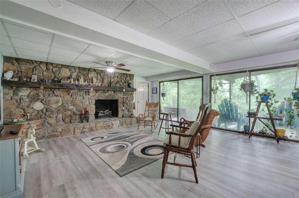 567 Fred Kelly Road Northeast Rome, GA 30161 - Photo 47 of 59 a living room with furniture and a floor to ceiling window