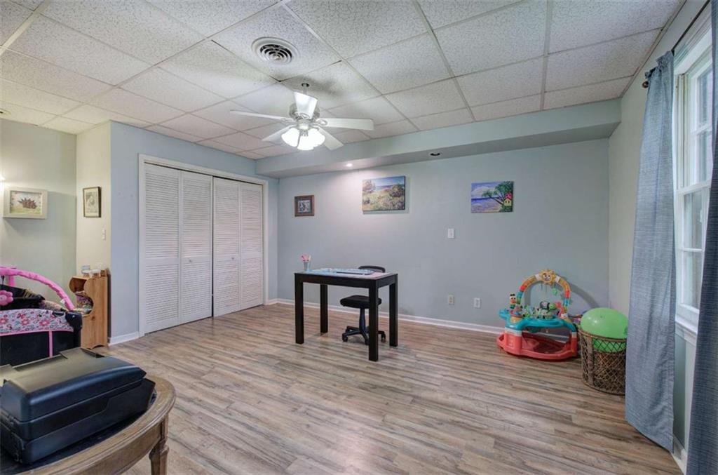 567 Fred Kelly Road Northeast Rome, GA 30161 - Photo 48 of 59 a living room with furniture and wooden floor