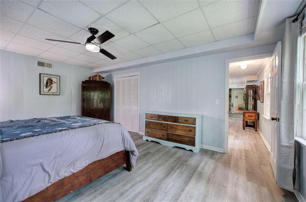 567 Fred Kelly Road Northeast Rome, GA 30161 - Photo 51 of 59 a bedroom with a bed and a chandelier