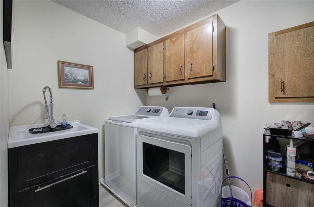 567 Fred Kelly Road Northeast Rome, GA 30161 - Photo 53 of 59 a utility room with sink dryer and washer