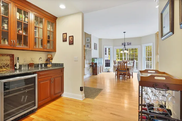 a kitchen with stainless steel appliances granite countertop a stove and cabinets