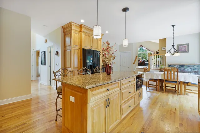 a view of living room with furniture and wooden floor