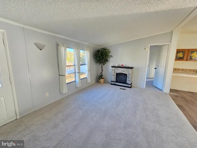 a view of a livingroom with a fireplace