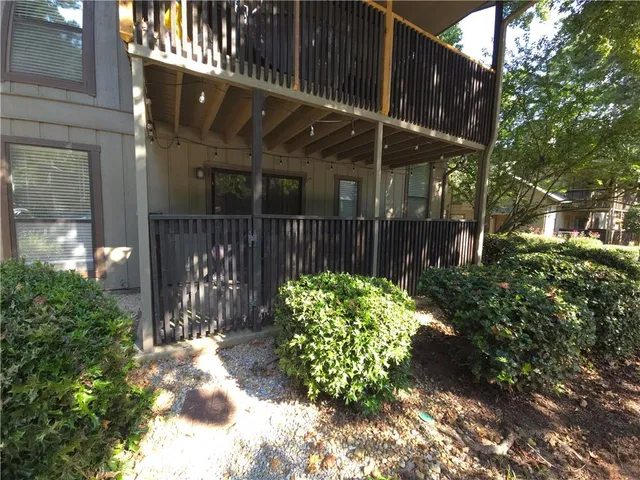a view of a house with a yard and plants