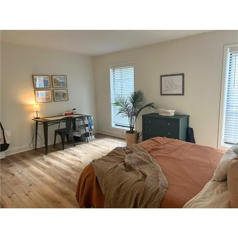 a bedroom with a bed and a table in it